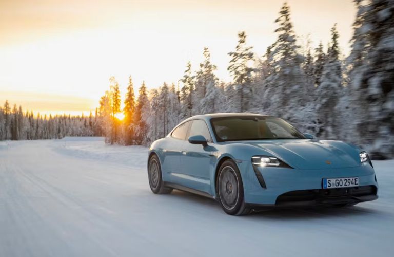 front quarter view of a Porsche EV in snow