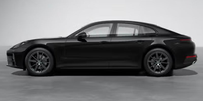 Side profile of a sleek, black Porsche Panamera with dark gray multi-spoke wheels on a light gray background.