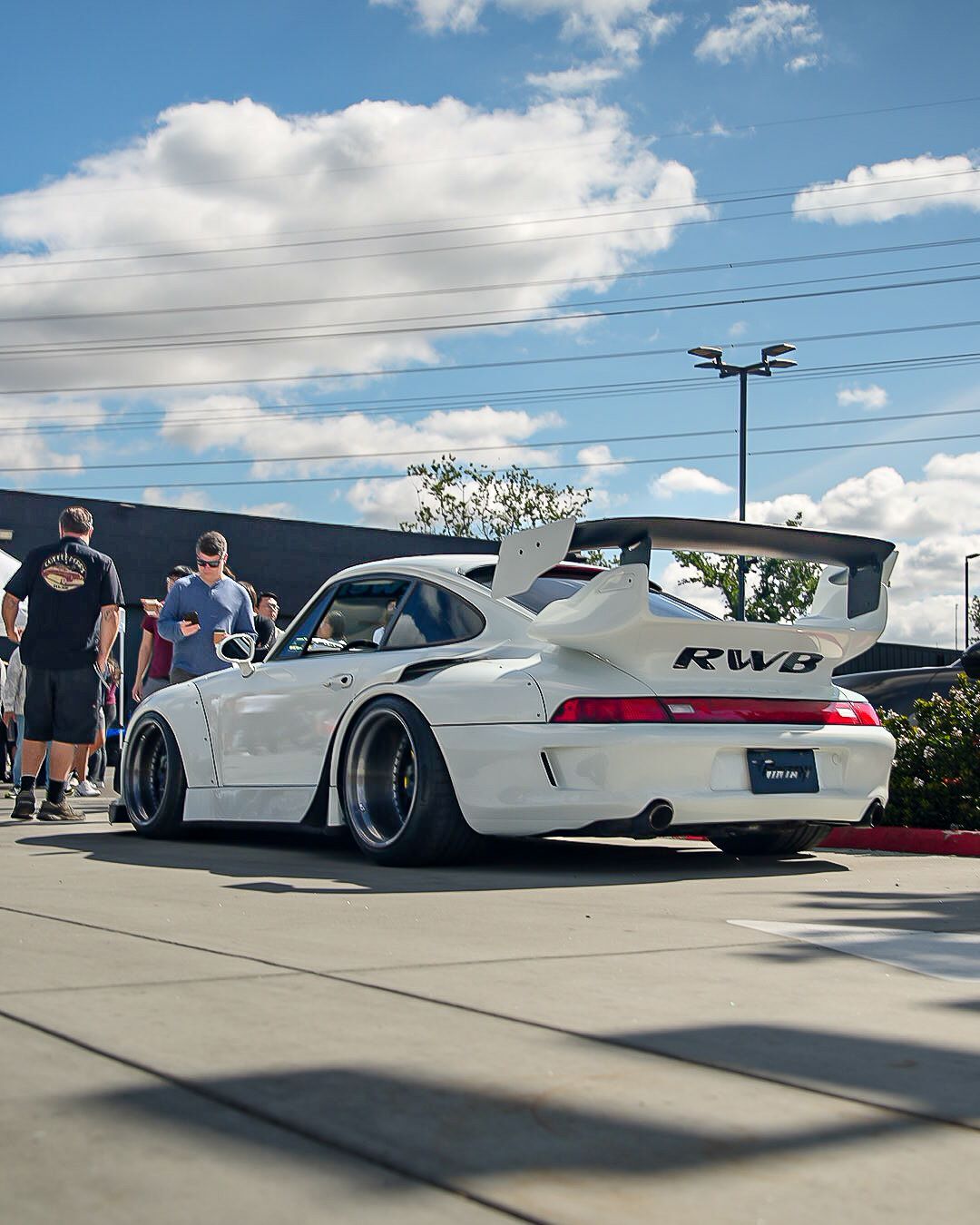 Rear view of a white wide-body Porsche 911 GT2 with 