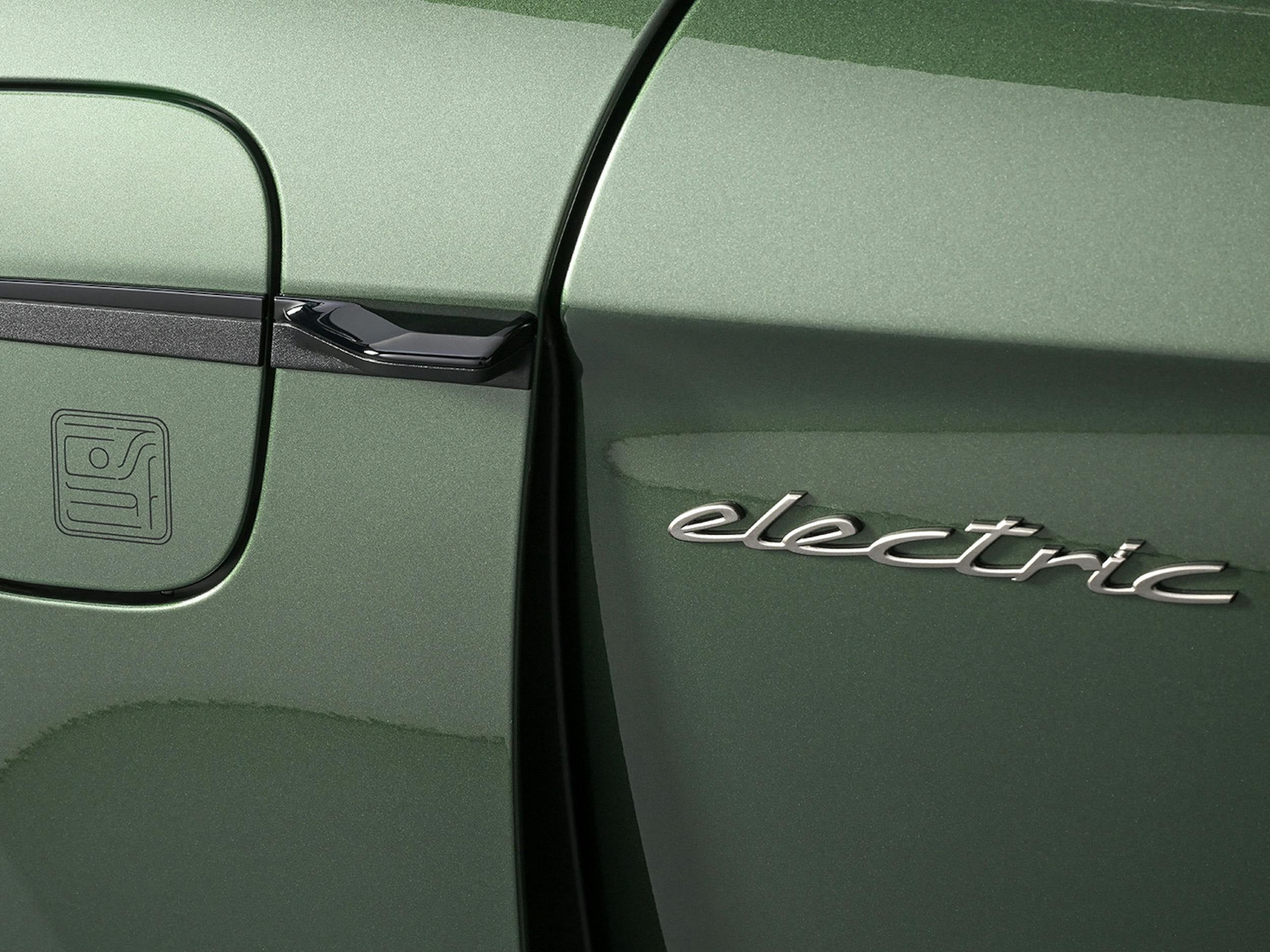 Close-up of a green Porsche electric vehicle showing the charging port and electric badging.